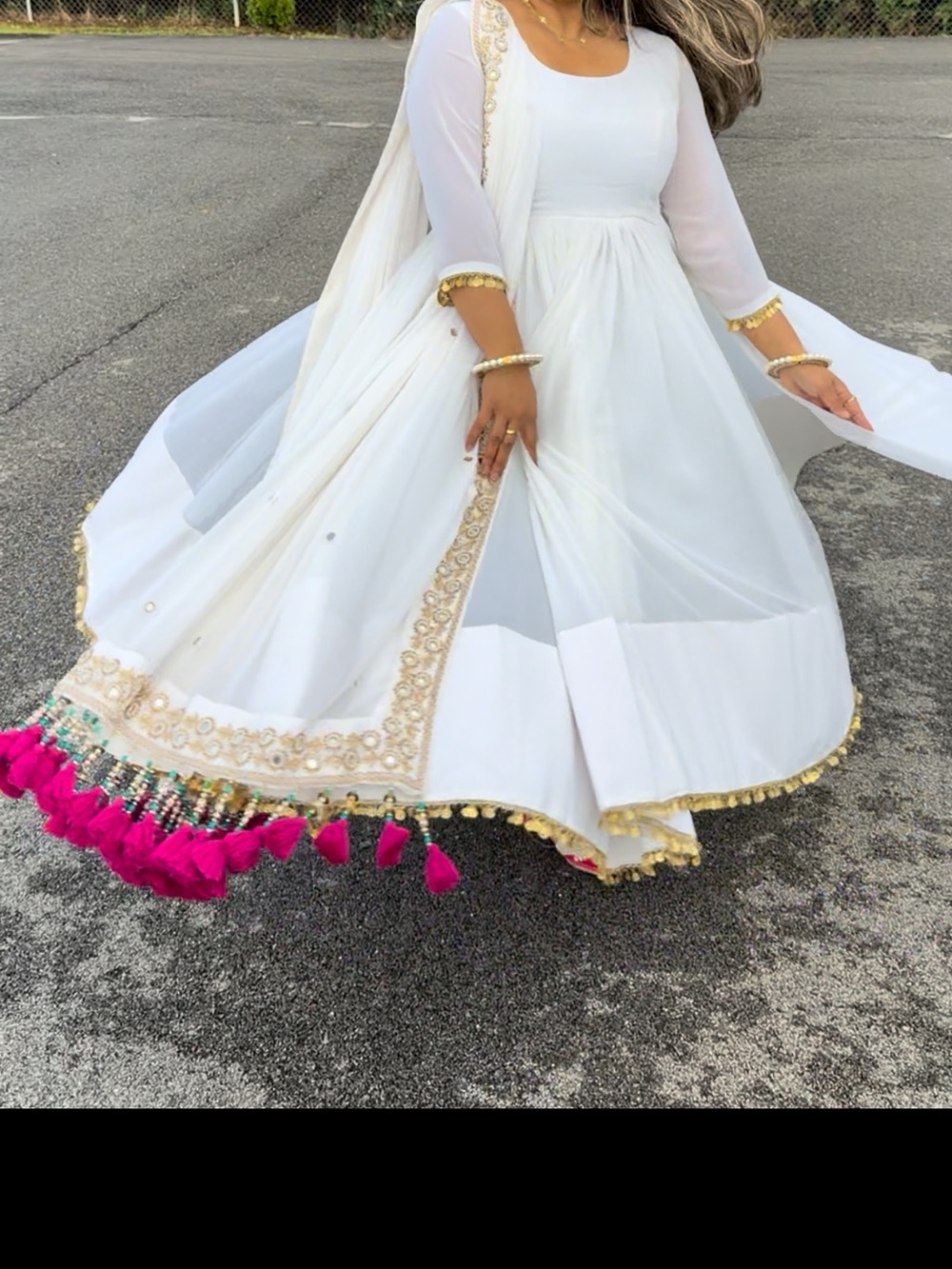 White Maxi Anarkali Dress with Gold Embellishments and Pink Tassels